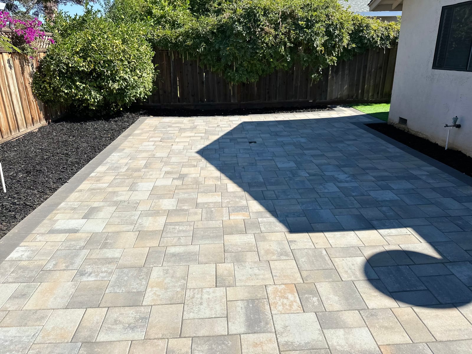 Two-tone paver patio with a dark border built by Royal Outdoor Solutions in Livermore, CA