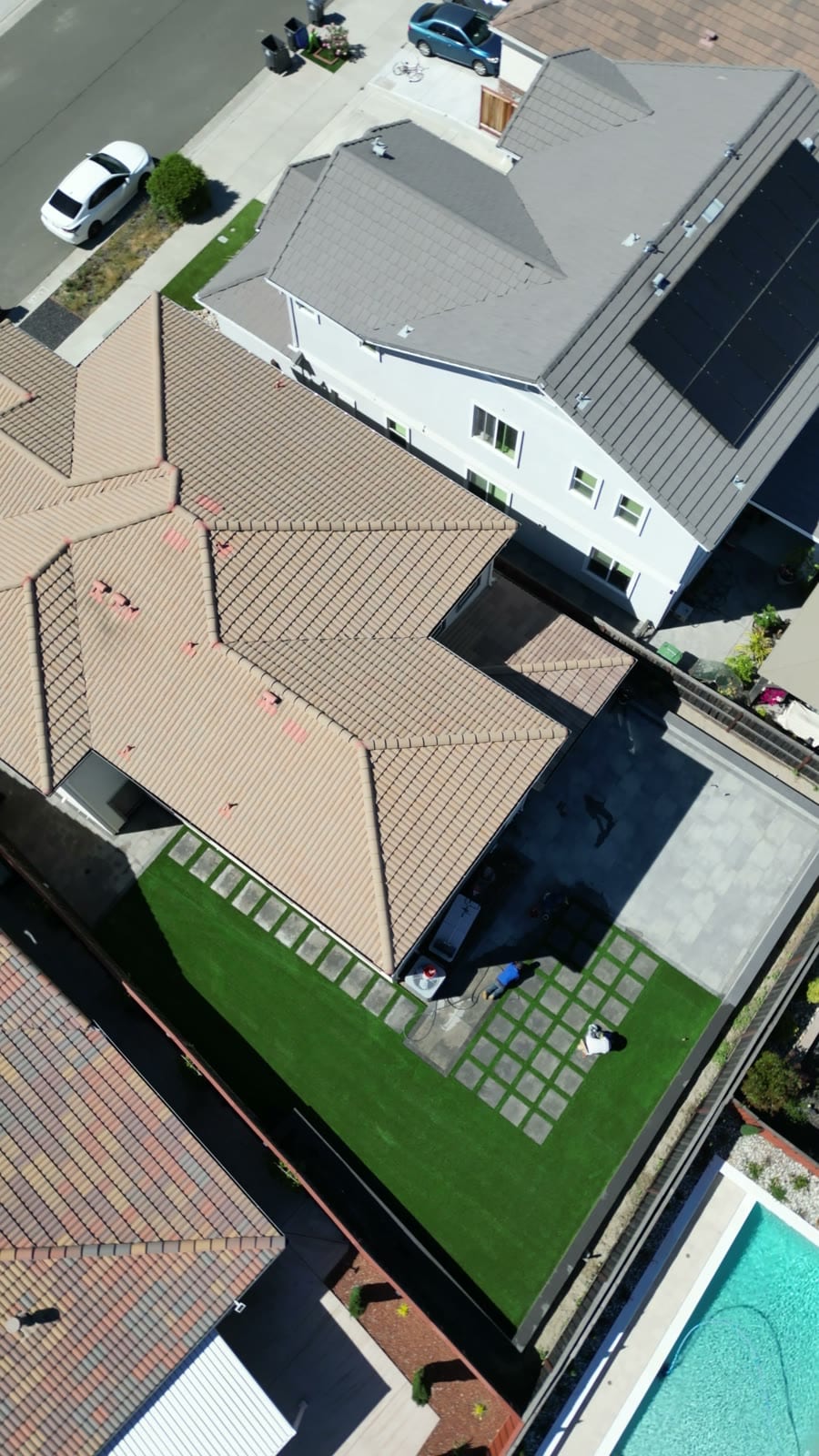 Wide aerial establishing shot of paver patio installation and backyard in Fairfield, CA